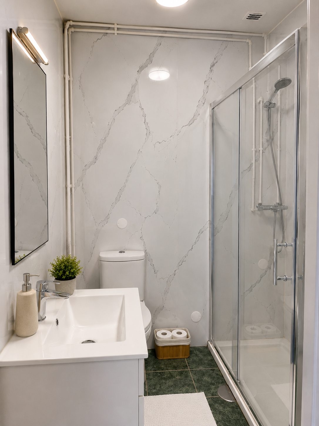 Bathroom with marbled tile, walk-in shower and white vanity